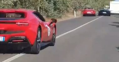 The blue Lamborghini can be seen trying to overtake the white campervan driving in front of it
