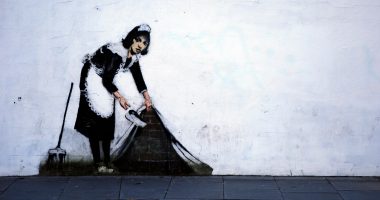 Why is Andrew Gallagher suing Banksy?