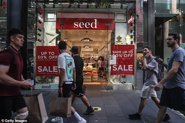 Australian incomes are going backwards because of record-high immigration and surging mortgage rates as elevated inflation causes pay levels to drop (pictured are pedestrians in Sydney's Pitt Street Mall)