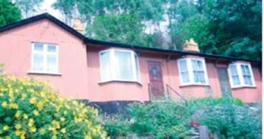 Buy a bungalow for 50p: Rundown homes made of corrugated tin are for sale in mining village priced at £1 for the pair - and seller says they'd make a perfect AirBnB