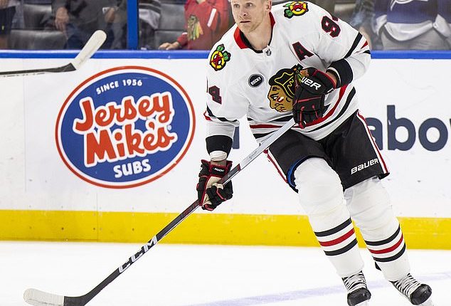 The Chicago Blackhawks are waiving and terminating the contract of Corey Perry