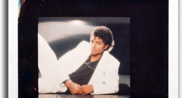The picture of Michael Jackson selected for the front cover depicts him laying on a counter wearing a white jacket and trousers with a black top. An almost identical Polaroid photo is included in the batch of five test pictures taken by Zimmerman for the shoot