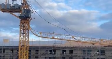 Emergency services rush person to hospital after crane 'snaps' and collapses onto new-build apartments under construction in Edinburgh