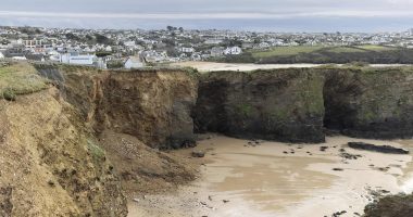 Major cliff fall at site marked for controversial luxury development just yards from houses as residents are warned to stay away with 'much more' expected to fall in next few hours