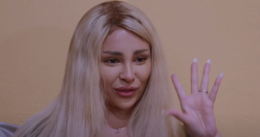 Sophie Sierra holds up one hand expressively while speaking.