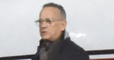 Tom Hanks greets Liverpool airport staff with a warm handshake after travelling to Merseyside on an ozone-burning private jet for theatre show