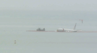US Navy plane overshoots runway, ends up in Hawaii bay