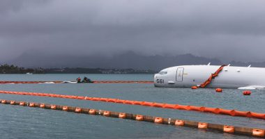 US Navy removes fuel from plane that overshot Hawaii runway and is now resting on a reef and sand