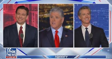 Florida Gov. Ron DeSantis (left) and California Gov. Gavin Newsom (right) met for a one-on-one debate hosted by Fox News and moderated by Sean Hannity (center) on Thursday night in Alpharetta, Georgia
