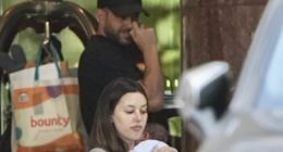 Adrian Portelli is seen with girlfriend Karlie Butler and newborn son