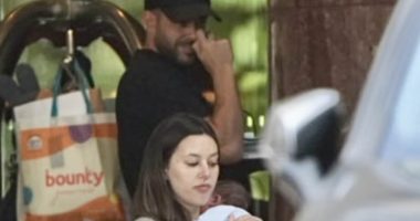 Adrian Portelli is seen with girlfriend Karlie Butler and newborn son