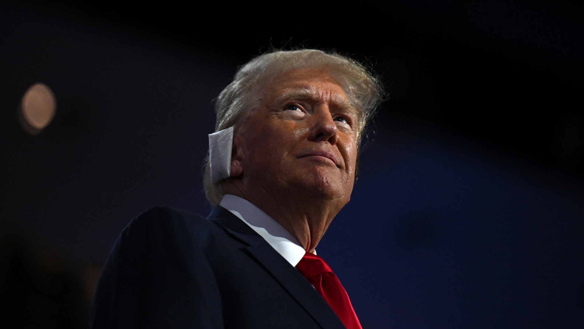 Donald Trump makes emotional public appearance at RNC surrounded by