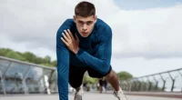 fit man demonstrating plank shoulder taps to reach your ideal weight fast