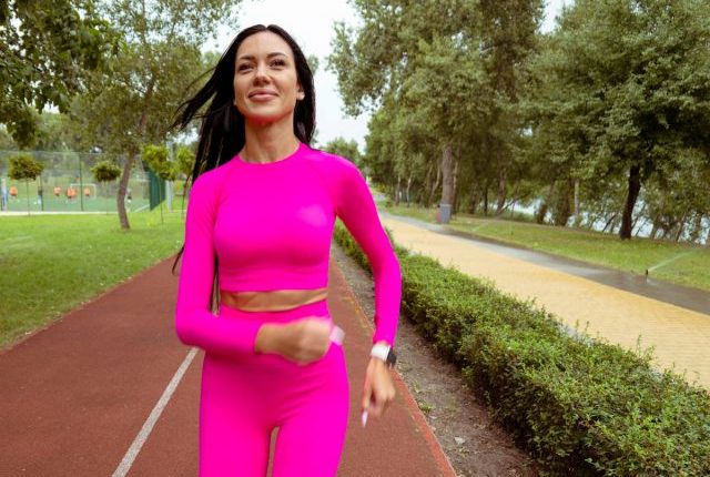woman walking on track, concept of 50-mile month walking challenge