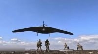 Russian soldiers launch a Supercam intelligence unmanned aerial vehicle