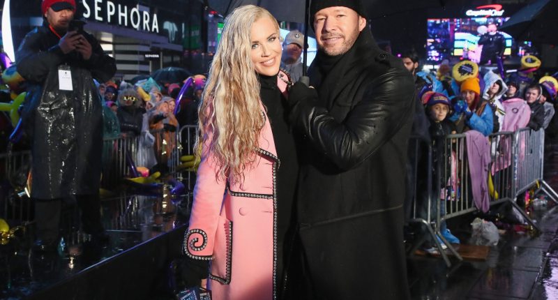 Jenny McCarthy and Donnie Wahlberg pose during Dick Clark