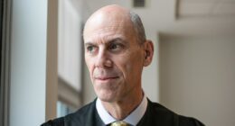 Justice Department files misconduct complaint against judge in key deportations case