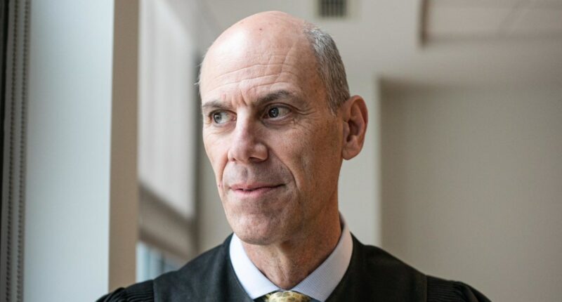 Justice Department files misconduct complaint against judge in key deportations case