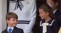 While looking out of the window of the Horse Guards building, Prince Louis bops along to the bagpipes