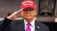 President Donald Trump salutes during the United States Military Academy commencement ceremonies in West Point on May 24
