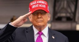 President Donald Trump salutes during the United States Military Academy commencement ceremonies in West Point on May 24