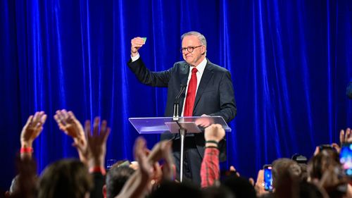 'Not Labor red or Liberal blue': Tearful Albanese celebrates win with favourite prop