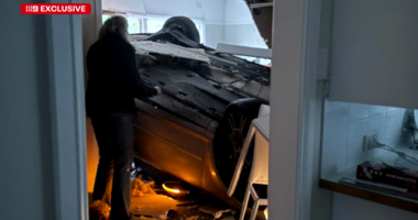 Car lands in woman's living room.