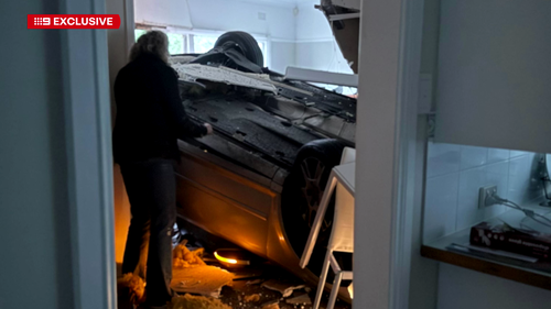 Car lands in woman's living room.
