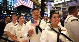 Military personnel at the New York Stock Exchange.