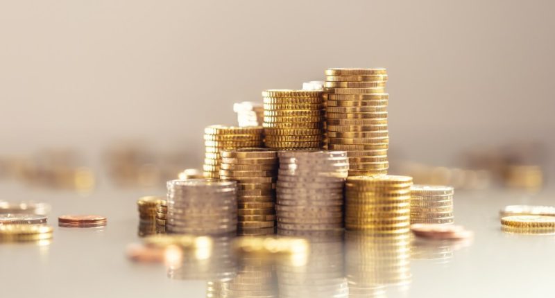 Stacks of euro coins symbolizing wealth.