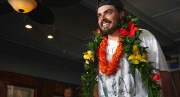 An Oregon man who quit his job to set sail with his cat arrives to cheering fans in Hawaii