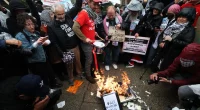 Anti-Israel protesters torch diplomas outside Columbia University on graduation day