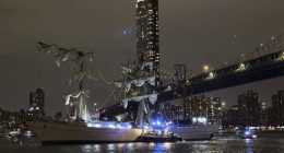 A masted Mexican Navy training ship, the CuauhtÃ©moc, sits stranded after colliding with the Brooklyn Bridge.