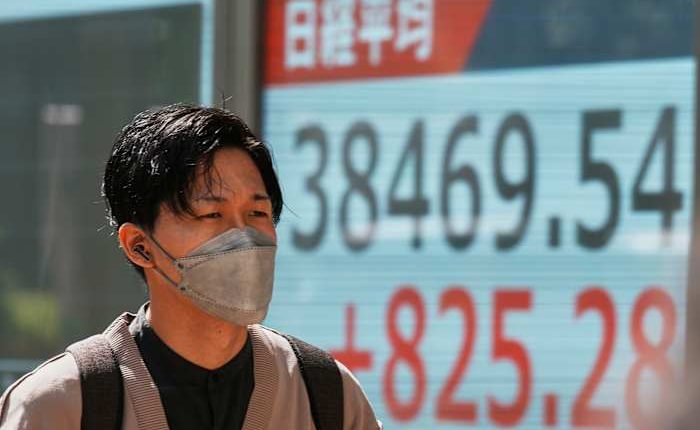 Asian shares gain after Wall Street's rally, but hopes are tempered by trade war uncertainties