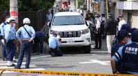 Police investigating a car accident involving children in Osaka, Japan.