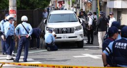 Police investigating a car accident involving children in Osaka, Japan.