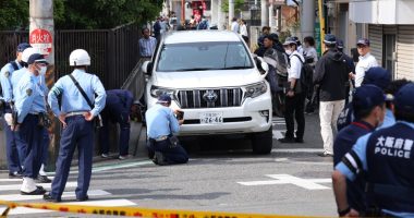 Police investigating a car accident involving children in Osaka, Japan.