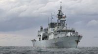 A Royal Australian Air Force P-8A Poseidon aircraft, working alongside Canadian Armed Forces HMCS Vancouver, conducting airborne surveillance to support enforcement of United Nations Security Council sanctions against North Korea under Operation Argos.
