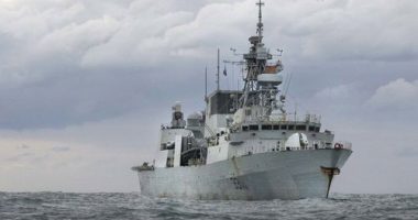A Royal Australian Air Force P-8A Poseidon aircraft, working alongside Canadian Armed Forces HMCS Vancouver, conducting airborne surveillance to support enforcement of United Nations Security Council sanctions against North Korea under Operation Argos.