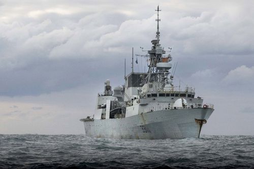 A Royal Australian Air Force P-8A Poseidon aircraft, working alongside Canadian Armed Forces HMCS Vancouver, conducting airborne surveillance to support enforcement of United Nations Security Council sanctions against North Korea under Operation Argos.