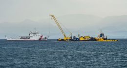 Italian Coast Guard ship assisting in the recovery of a sunken superyacht.