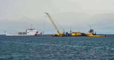 Italian Coast Guard ship assisting in the recovery of a sunken superyacht.