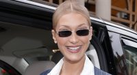 Bella Hadid looks sophisticated in a pinstriped dress in London