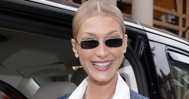 Bella Hadid looks sophisticated in a pinstriped dress in London
