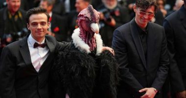 Bird man on red carpet leaves Cannes squawking