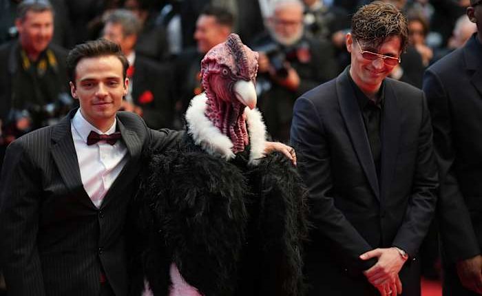 Bird man on red carpet leaves Cannes squawking