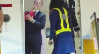 Emmanuel Macron being slapped by a woman as he exits a plane.