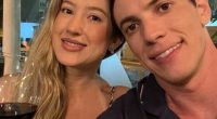 Couple taking a selfie at a restaurant.
