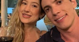 Couple taking a selfie at a restaurant.