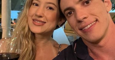 Couple taking a selfie at a restaurant.